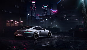Silver Porsche 911 Carrera S parked on wet cobblestones in a neon-lit city at night HD wallpaper