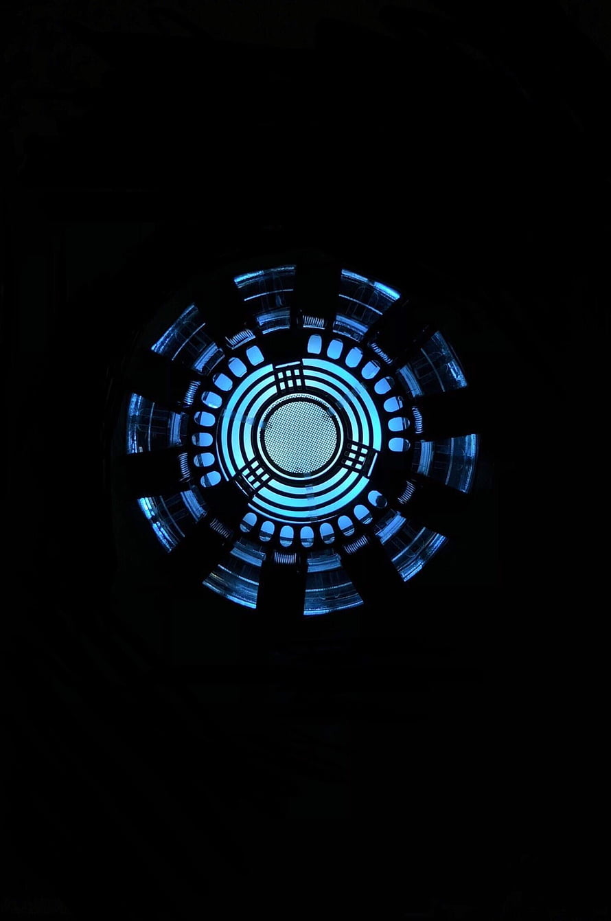 Glowing Arc Reactor Core with Blue Illumination on Black Background HD phone wallpaper