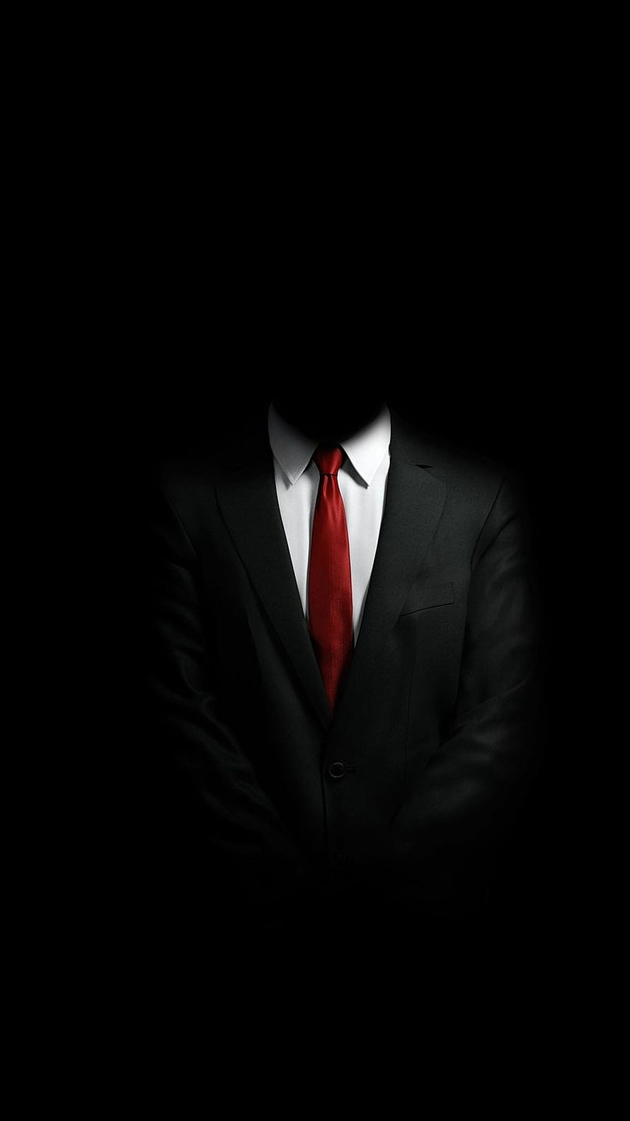 Mysterious Faceless Man in Black Suit with Red Tie Against Dark Background HD phone wallpaper