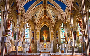 Gothic Cathedral Interior with Stained Glass Windows and Ornate Altar HD wallpaper