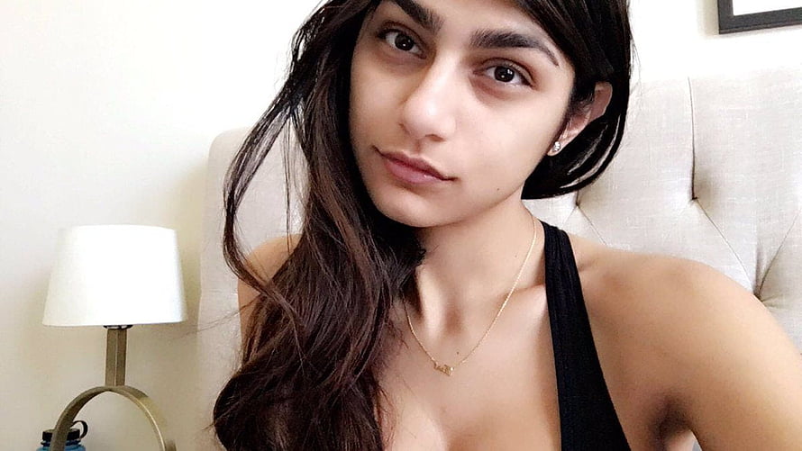 Mia Khalifa Close-Up Portrait in Black Top with Gold Necklace HD wallpaper