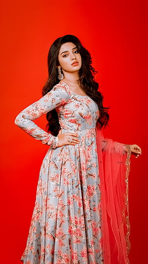 Krithi Shetty in Floral Anarkali Suit with Red Dupatta on Vibrant Background HD phone wallpaper