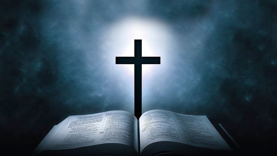 Illuminated Christian Cross Rising Above Open Bible in Dramatic Mist HD wallpaper