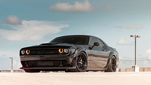 Black Dodge Challenger SRT Hellcat Muscle Car on Open Road HD wallpaper