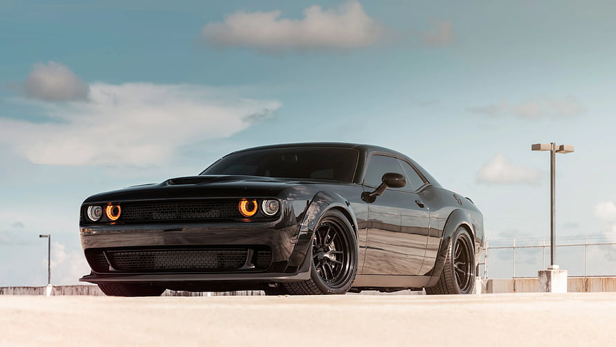 Black Dodge Challenger SRT Hellcat Muscle Car on Open Road HD wallpaper