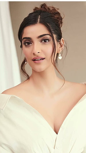 Sonam Kapoor in an elegant off-shoulder cream blouse with a soft updo and delicate gold earrings HD phone wallpaper