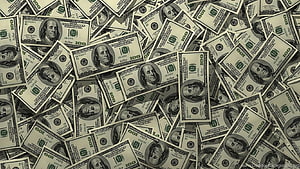 Scattered US One Hundred Dollar Bills Covering the Entire Frame in a Dense Financial Pattern HD wallpaper