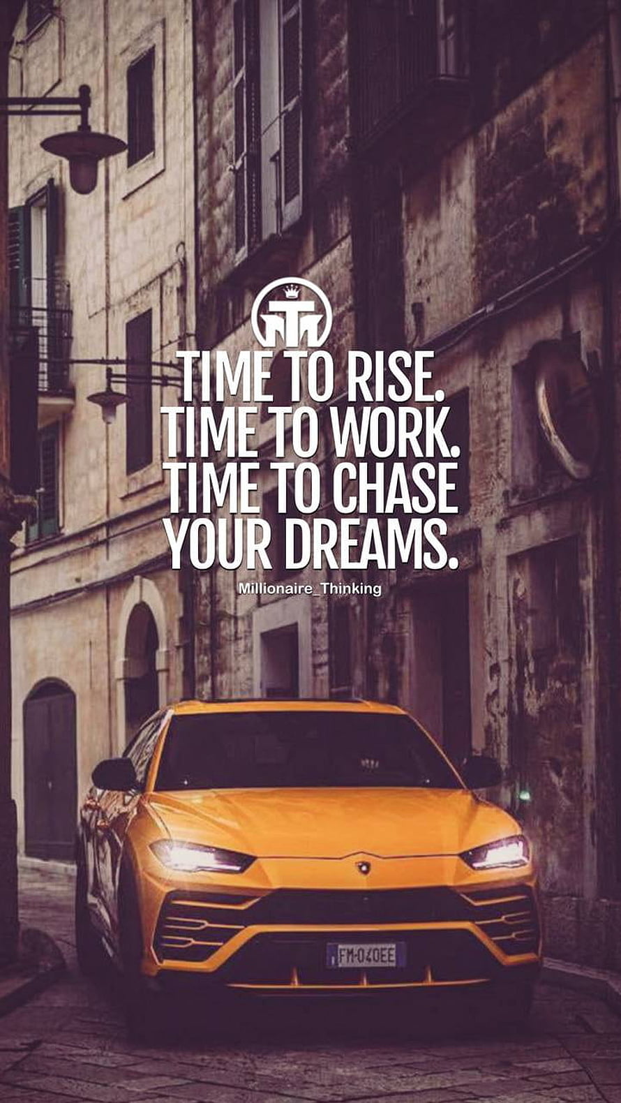 Orange Lamborghini Urus on European Street with Motivational Quote Overlay HD phone wallpaper