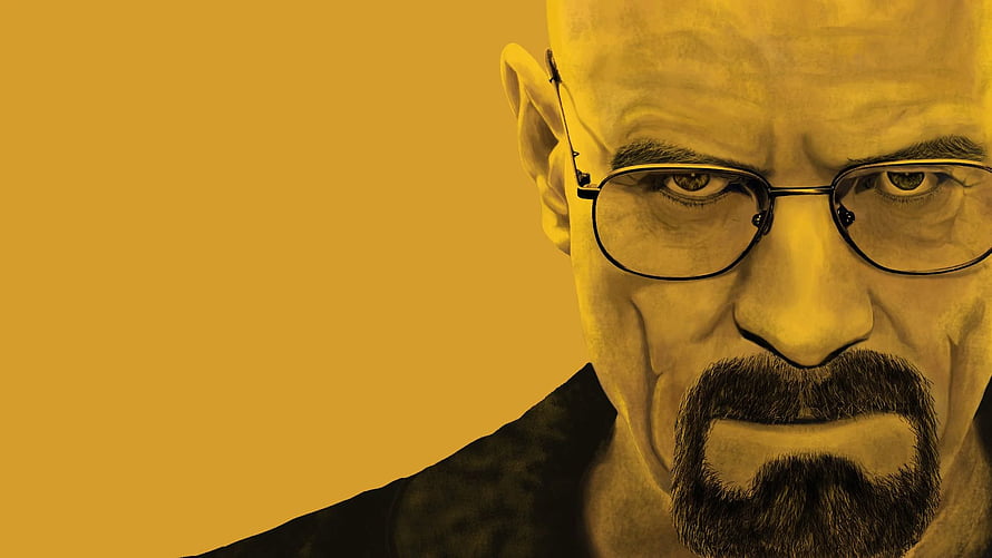 Walter White from Breaking Bad in a dramatic yellow-toned close-up portrait with glasses and goatee HD wallpaper