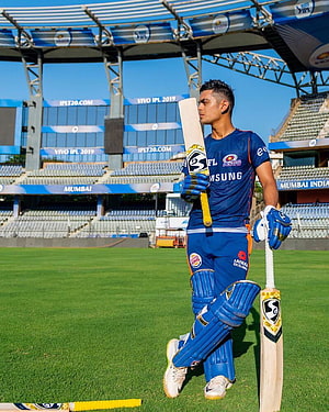 Ishan Kishan in Mumbai Indians kit holding cricket bat at Wankhede Stadium HD phone wallpaper