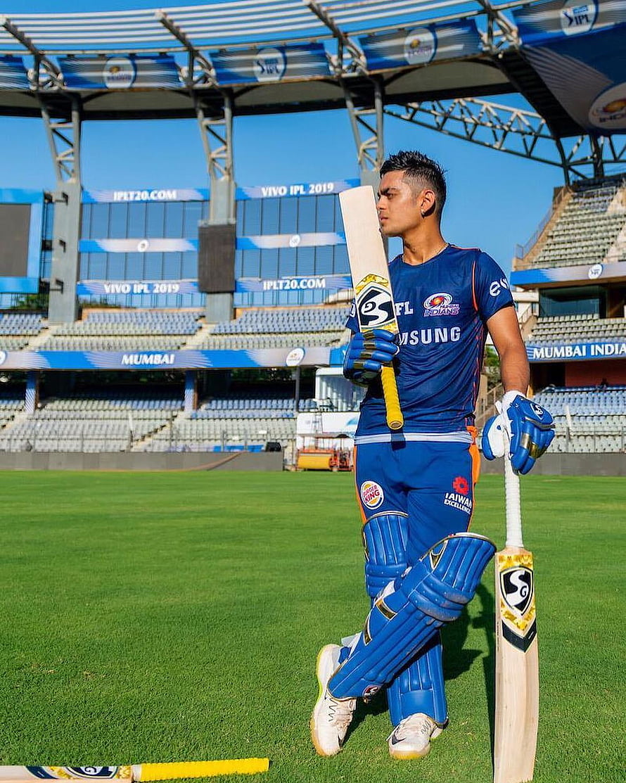 Ishan Kishan in Mumbai Indians kit holding cricket bat at Wankhede Stadium HD phone wallpaper
