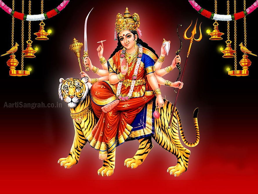 Goddess Durga Riding a Tiger with Multiple Arms and Divine Weapons HD wallpaper