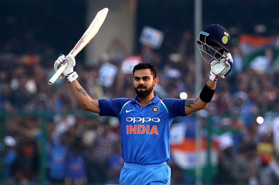 Virat Kohli Celebrating with Bat and Helmet in India Cricket Jersey HD wallpaper