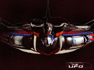 Grendizer Mecha Robot Front View with Red and Blue Accents on Dark Background HD wallpaper