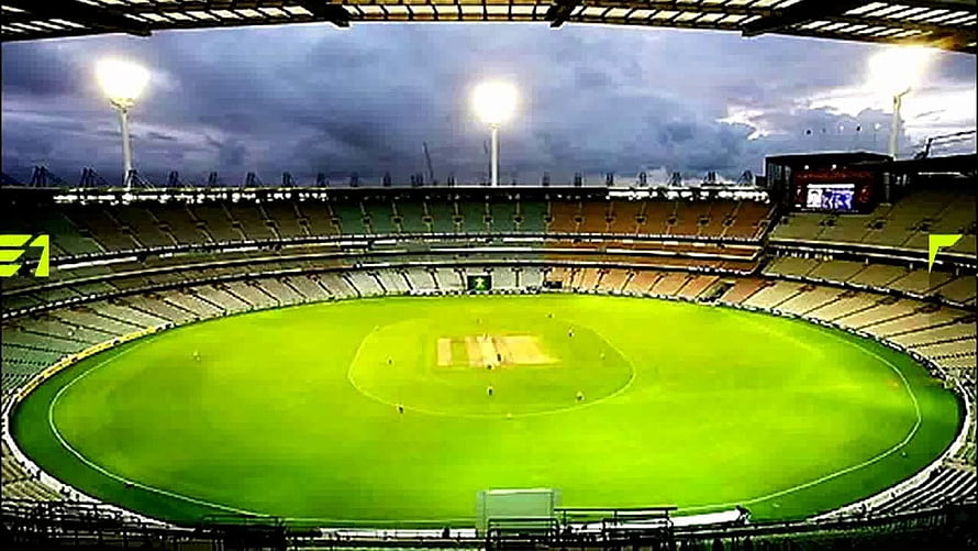 Vibrant Cricket Stadium Under Dramatic Stormy Sky With Floodlights HD wallpaper