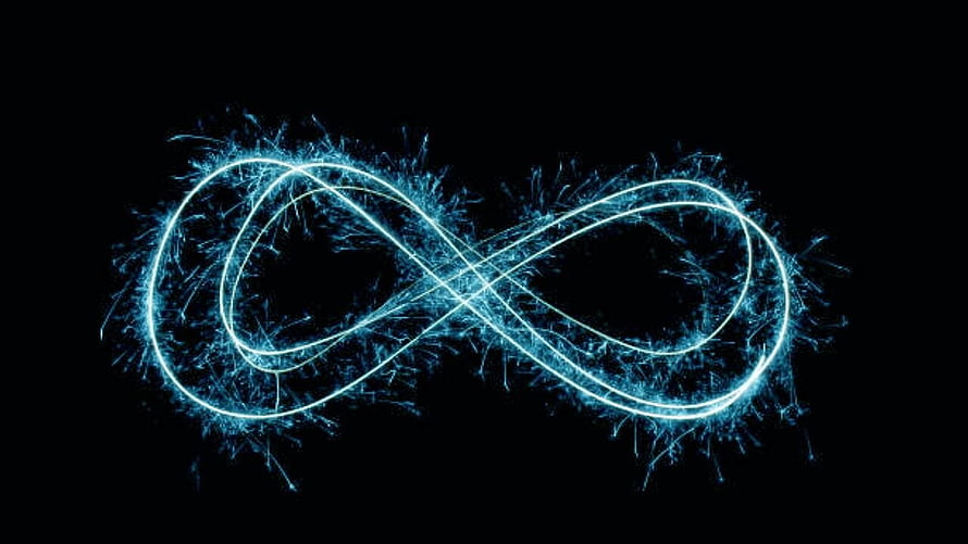 Glowing Blue Infinity Symbol with Electric Particles on Black Background HD wallpaper