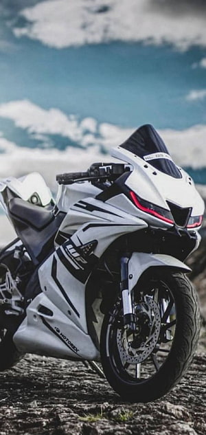 White MotoRex KL-09 Sport Motorcycle Parked on Rocky Terrain Under Blue Sky HD phone wallpaper