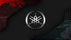 Yamaha Tuning Fork Emblem on Dark Hexagonal Background with Red and Blue Accents HD wallpaper