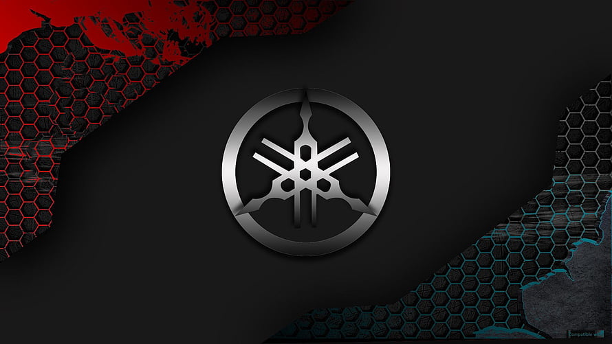 Yamaha Tuning Fork Emblem on Dark Hexagonal Background with Red and Blue Accents HD wallpaper