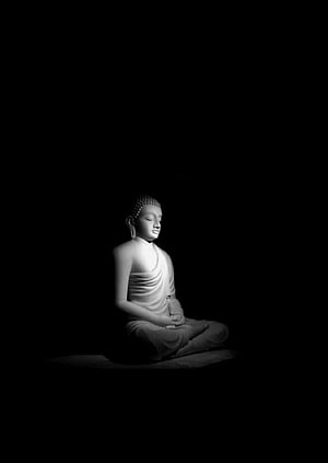 Serene Buddha Statue in Meditation Against a Dark Background HD phone wallpaper