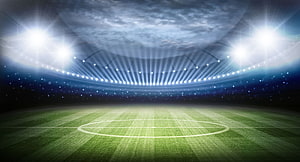 Empty Soccer Stadium Under Bright Floodlights at Night HD wallpaper