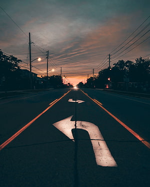 Empty City Road at Dusk with Directional Arrows and Power Lines HD phone wallpaper