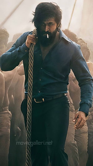 Yash as Rocky Bhai in KGF with cigarette and rope in dramatic cinematic scene HD phone wallpaper