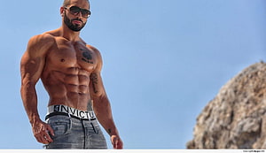 Muscular shirtless man with sunglasses and tattoos standing outdoors against a clear blue sky, All Bodybuilder, Indian Body Builder HD wallpaper