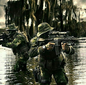 Kopassus Special Forces Soldiers Advancing Through Swamp Water With Tactical Rifles HD wallpaper