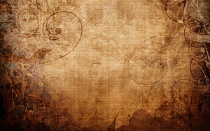 Aged Sepia Textured Background with Ornate Floral Swirls and Vintage Grunge Details HD wallpaper