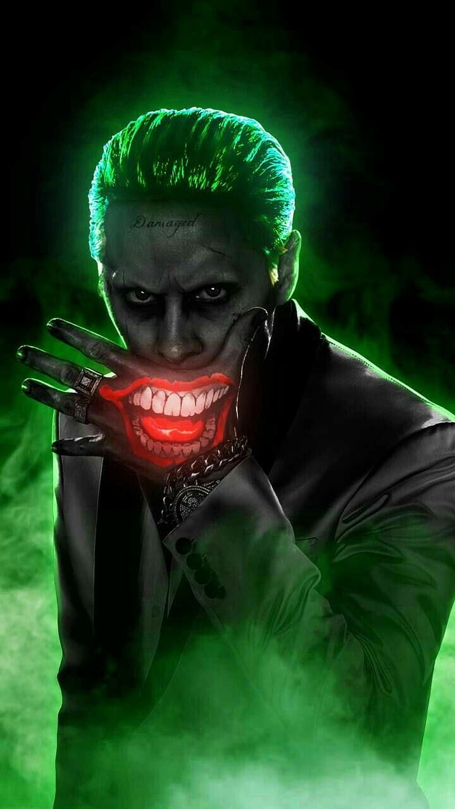Joker with glowing green hair and red smile in dark suit with smoke HD phone wallpaper