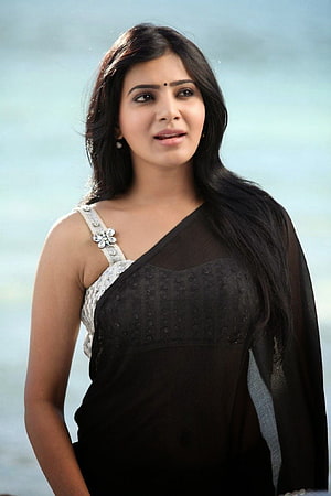 Samantha in a black sheer saree with white embellished blouse against a soft blue background HD phone wallpaper