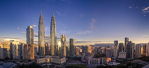 Petronas Twin Towers and Kuala Lumpur City Center Skyline at Golden Hour HD wallpaper