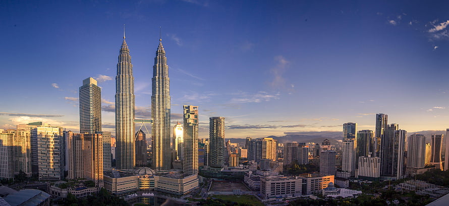 Petronas Twin Towers and Kuala Lumpur City Center Skyline at Golden Hour HD wallpaper