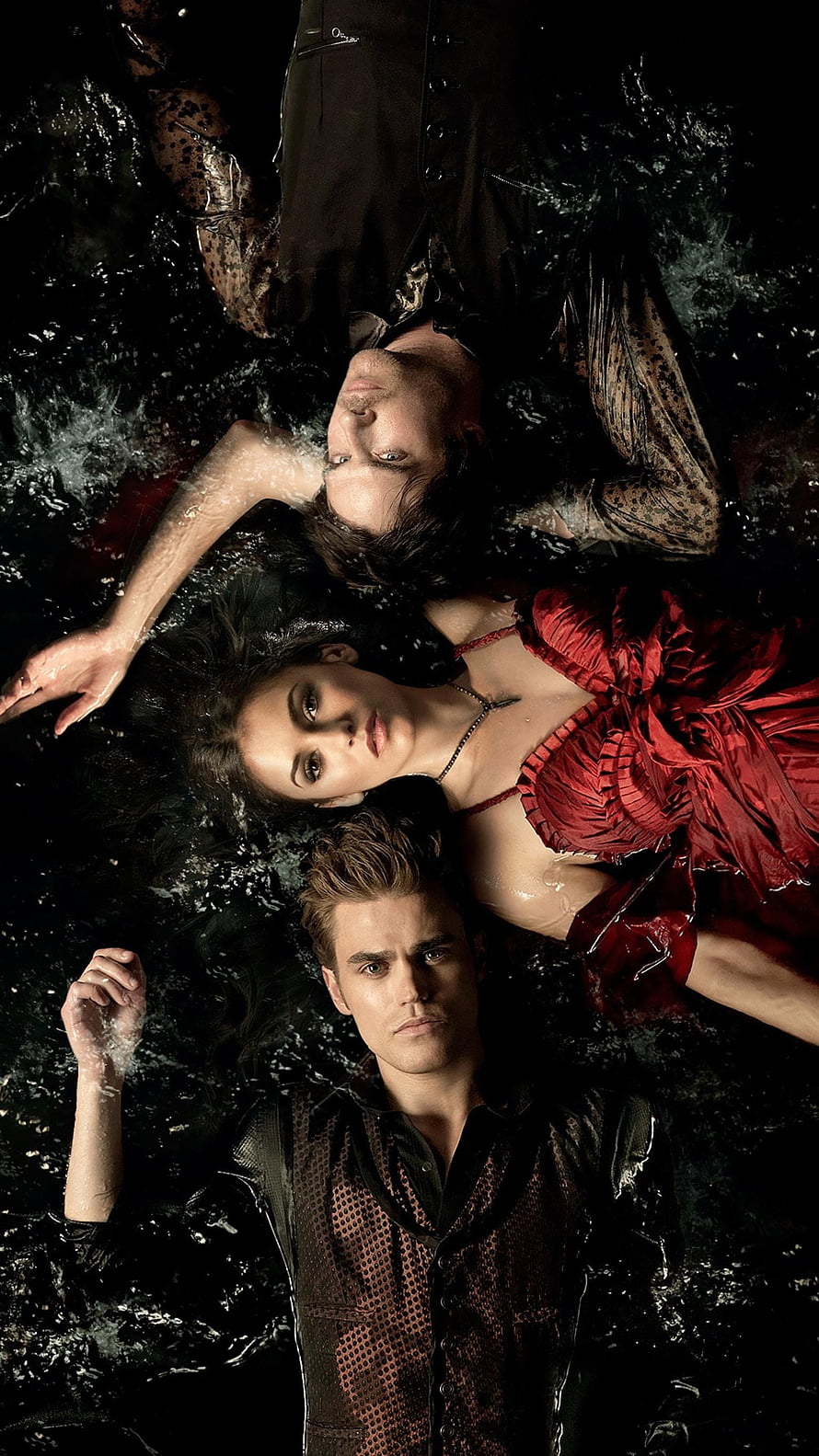 The Vampire Diaries promotional still featuring three characters submerged in dark water HD phone wallpaper