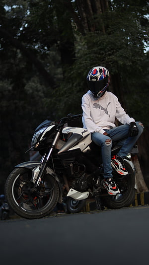Rider on a Bajaj Pulsar NS200 Motorcycle in a White Puma Hoodie HD phone wallpaper