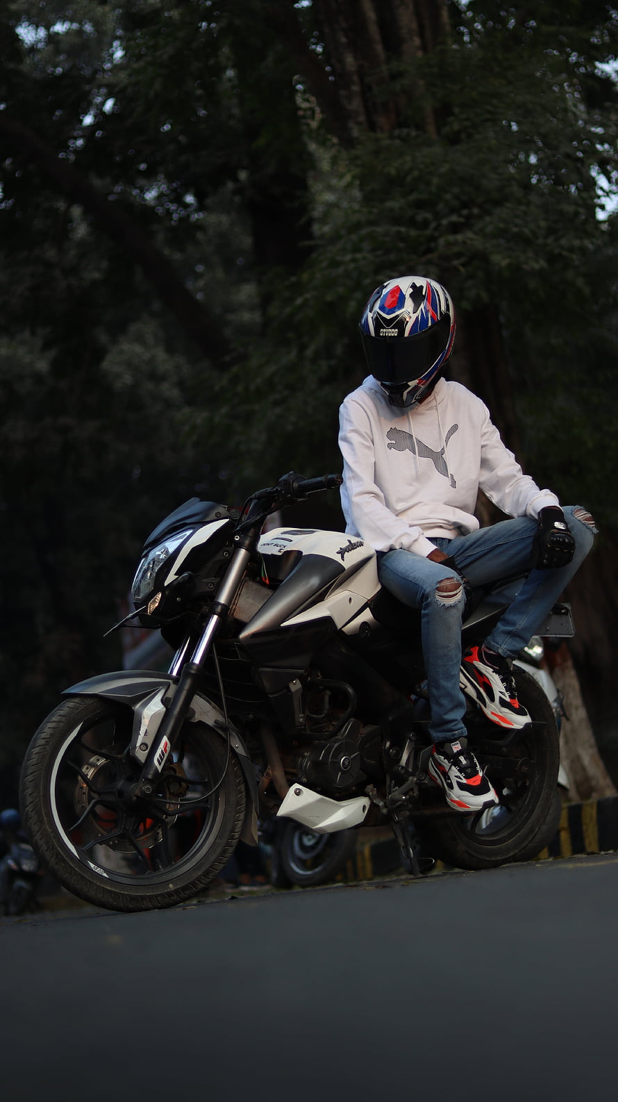 Rider on a Bajaj Pulsar NS200 Motorcycle in a White Puma Hoodie HD phone wallpaper