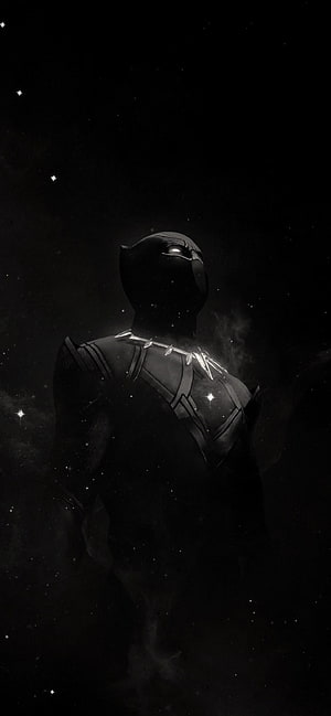Black Panther in a dark cosmic setting with glowing silver necklace and starry background HD phone wallpaper