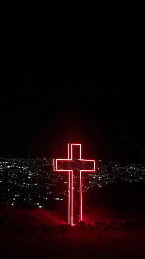 Glowing Red Neon Cross Overlooking a City at Night HD phone wallpaper
