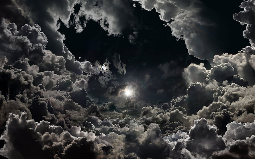 Dramatic Night Sky with Moonlight Breaking Through Dark Storm Clouds HD wallpaper
