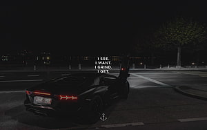 Black Lamborghini Huracan Night Scene with Motivational Quote Overlay HD wallpaper