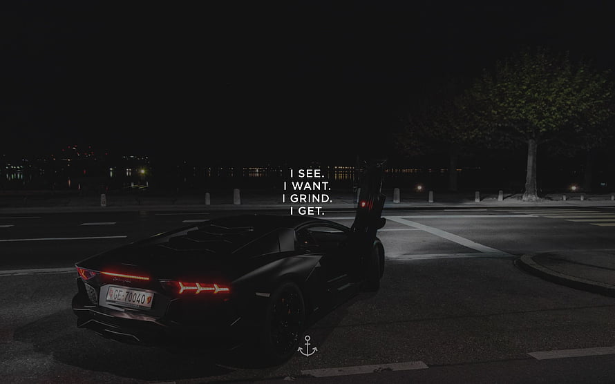 Black Lamborghini Huracan Night Scene with Motivational Quote Overlay HD wallpaper
