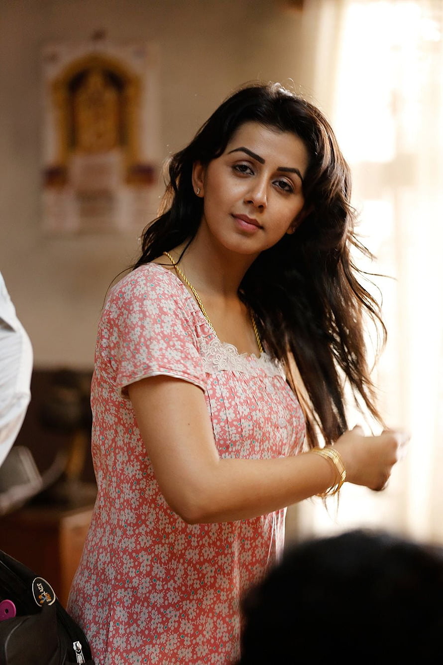 Nikki Galrani in a pink floral dress with long dark hair and gold jewelry HD phone wallpaper
