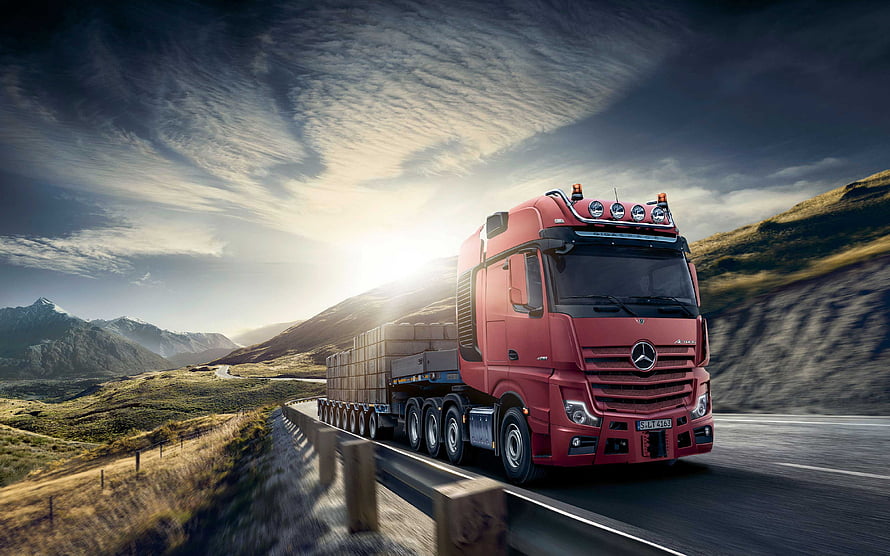 Red Mercedes-Benz Actros Heavy Truck Hauling Concrete Blocks on Mountain Highway HD wallpaper
