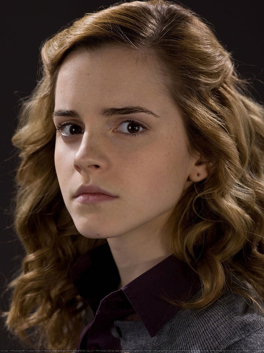 Hermione Granger from Harry Potter in a Close-Up Portrait with Wavy Hair and a Serious Expression HD phone wallpaper