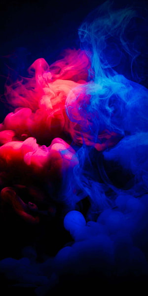 Vibrant red and blue ink clouds swirling in dark water, abstract neon smoke photography HD phone wallpaper