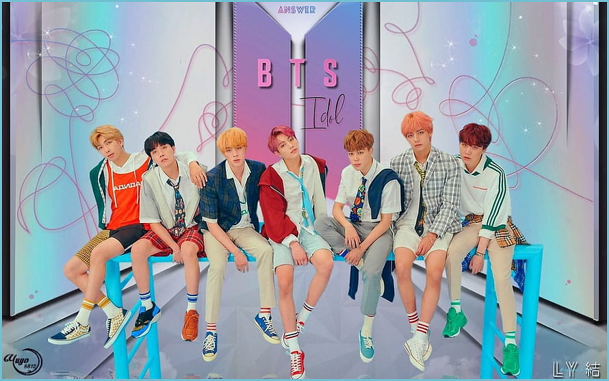 BTS Members Sitting on Blue Bench in Colorful Studio Setting HD wallpaper