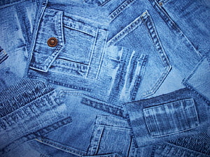 Close-up of stacked blue denim jeans pockets and copper rivets HD wallpaper