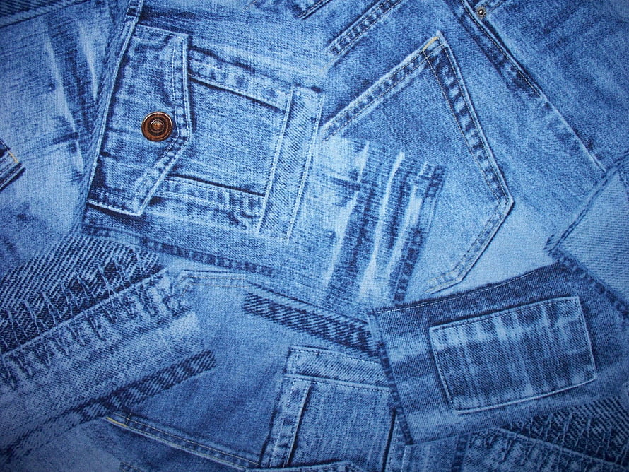 Close-up of stacked blue denim jeans pockets and copper rivets HD wallpaper