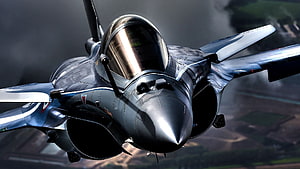 Dassault Rafale Fighter Jet Banking Through Clouds Over Rural Terrain HD wallpaper